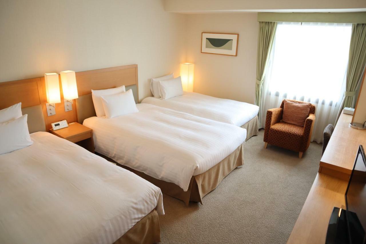 Hotel Associa Sizuoka Kültér fotó A typical room at the hotel